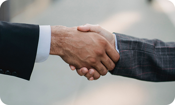 Business partnership handshake
