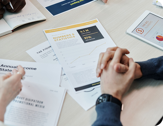 A team reviewing total rewards documents